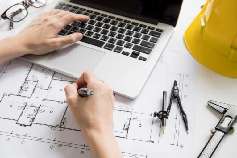 crop hands using laptop drawing draft